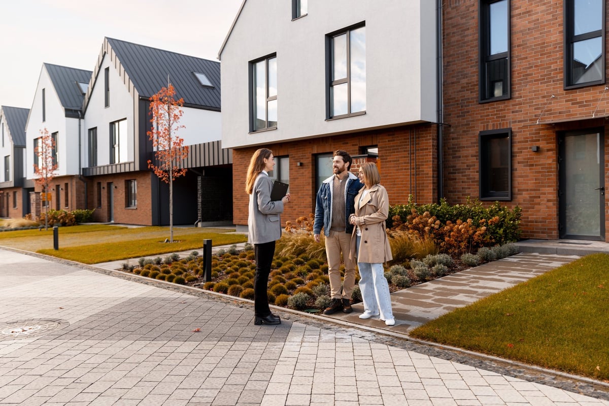 Property owner and operator reviewing a lease agreement at a table